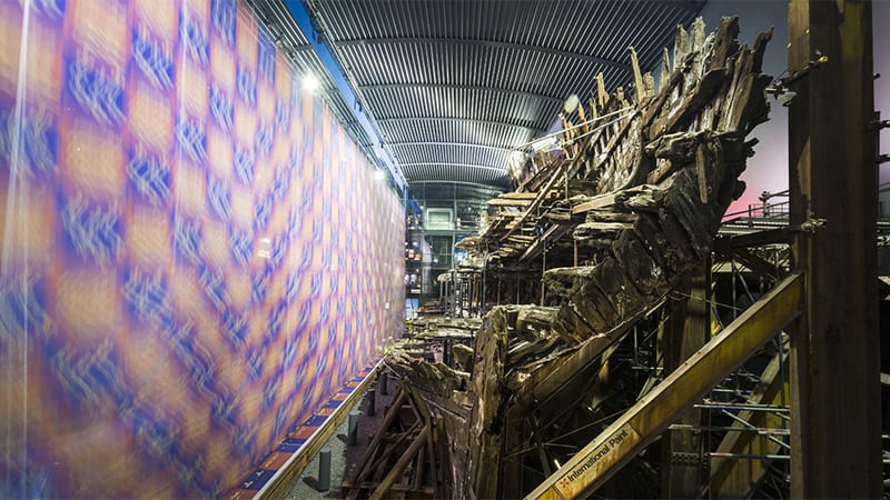 Side view of the Mary Rose behind curtains prior to the reveal.